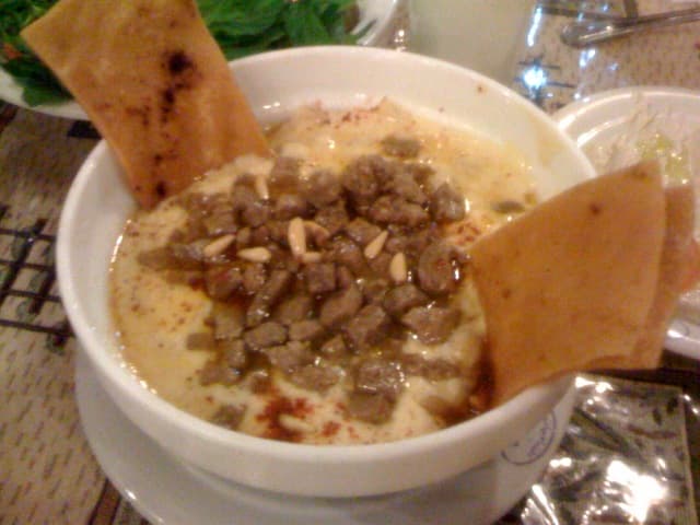 Fatteh — a egyptian main course dish from Egypt — featuring bread-forward, regional variations, layered construction