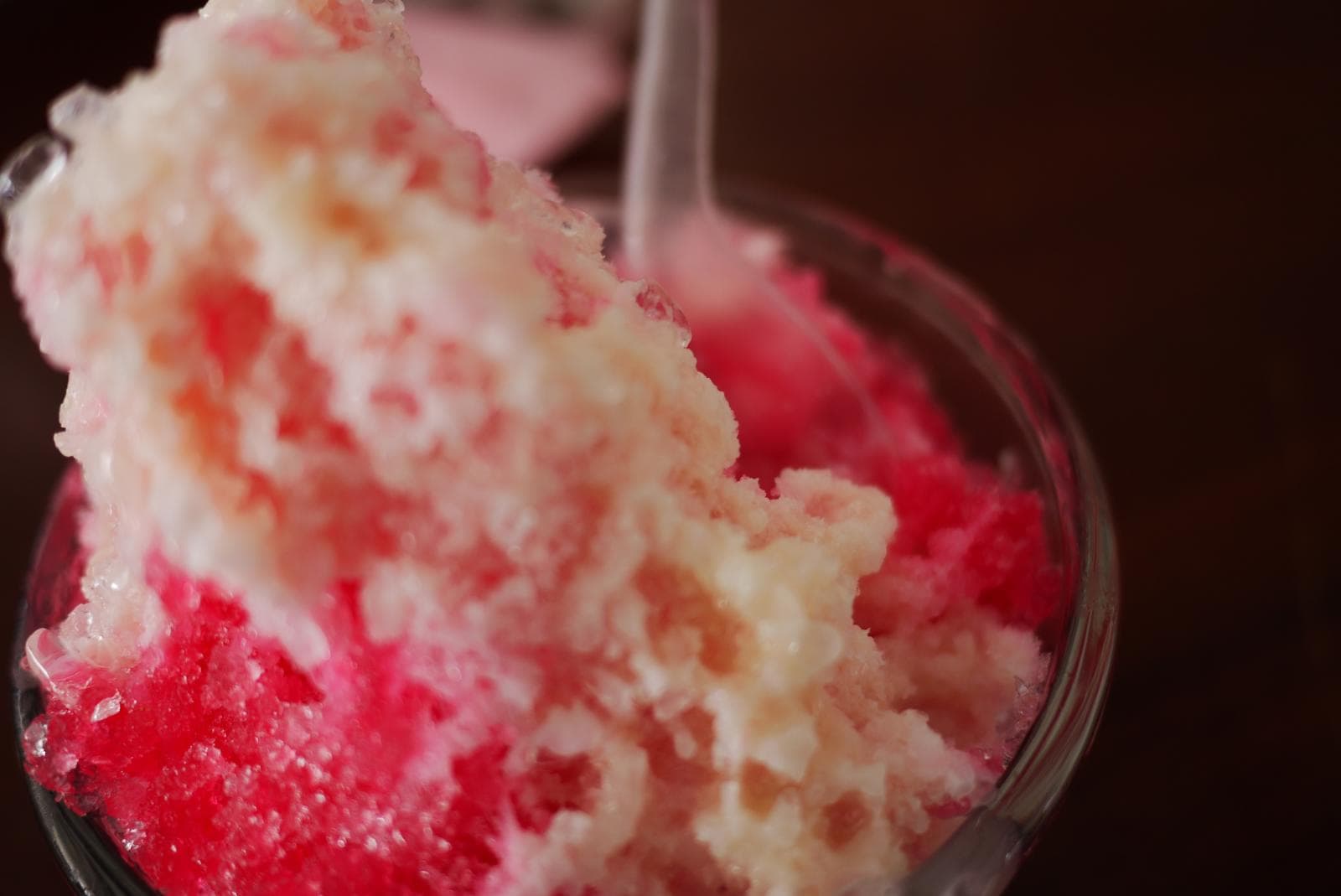 Namkhaeng sai — a thai dessert dish from Thailand — featuring shaved ice, sweet syrup base, condensed milk