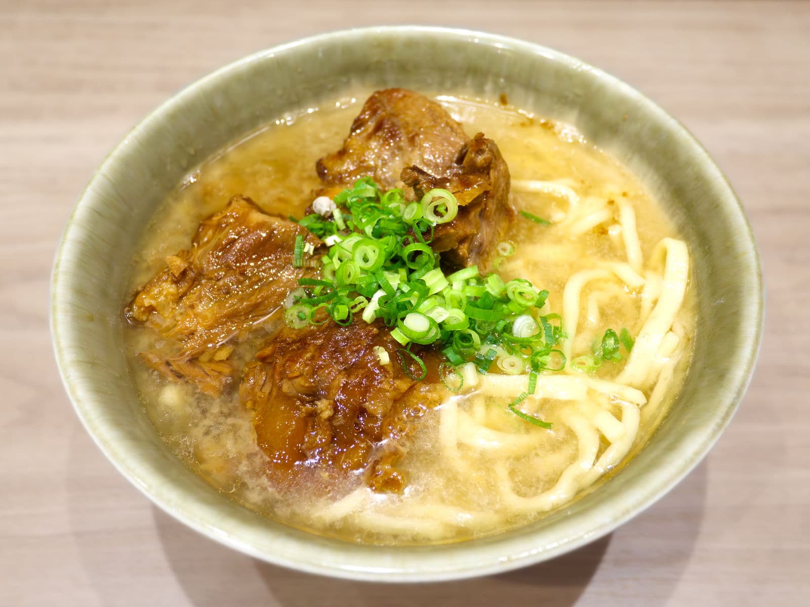 Okinawa soba — a japanese main course dish from Japan — featuring thick wheat noodles, pork broth, regional comfort