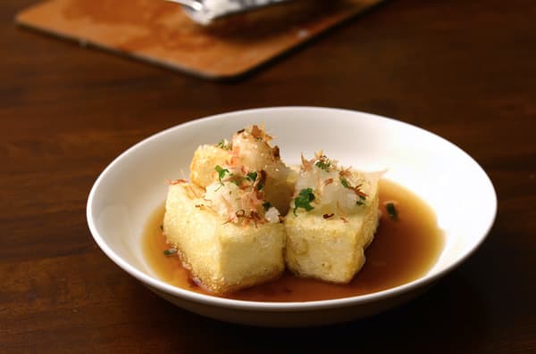 Agedashi dōfu — a japanese main course dish from Japan — featuring silken-textured, light-fried, aromatic-broth