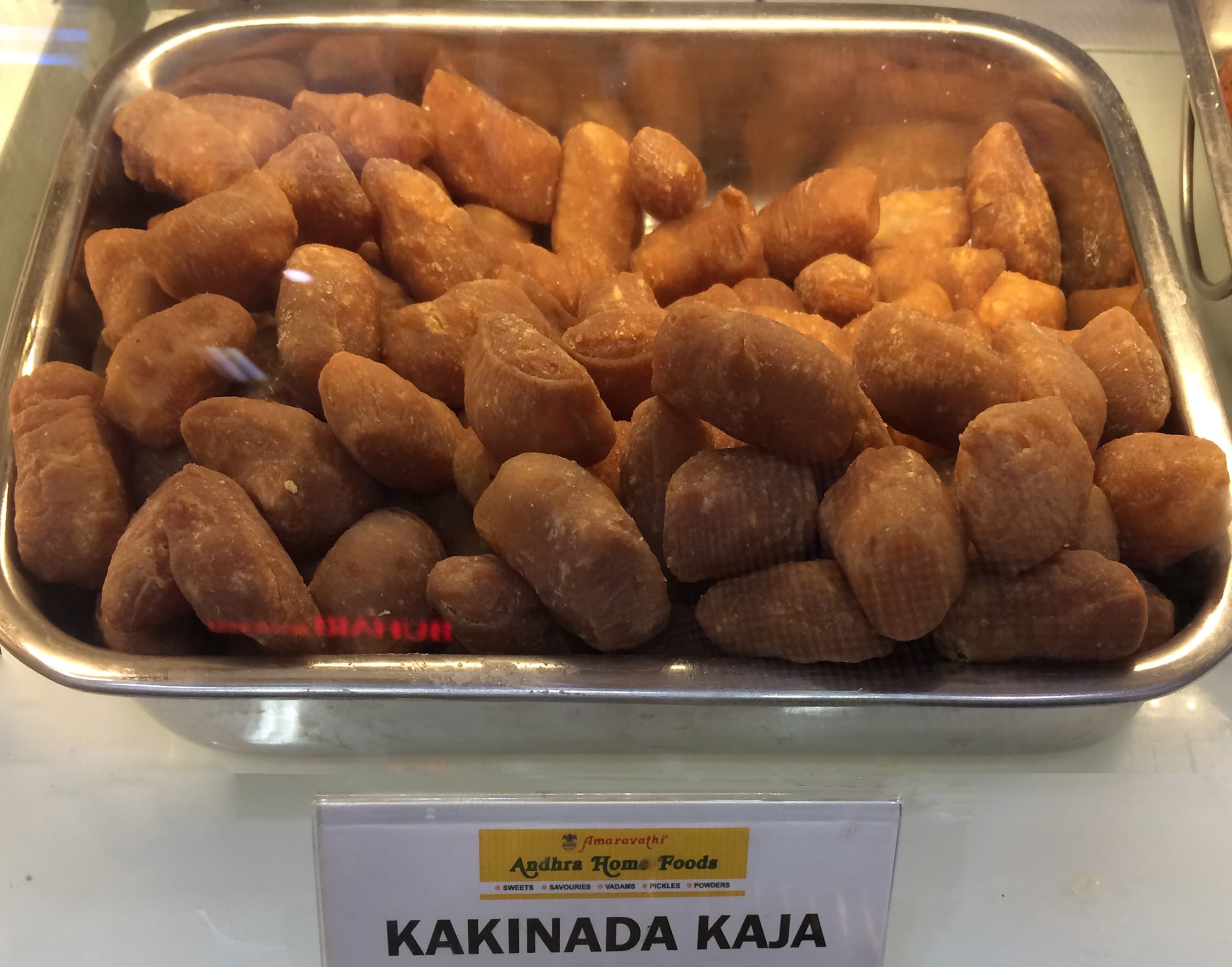 Kakinada Kaja — a uzbek dessert dish from Uzbekistan — featuring hollow cylindrical pastry, layered sweetness, Telugu heritage