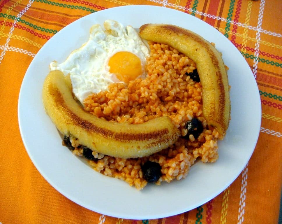 Arroz a la cubana — a spanish main course dish from Spain — featuring fried egg-topped, spanish colonial legacy, banana-forward