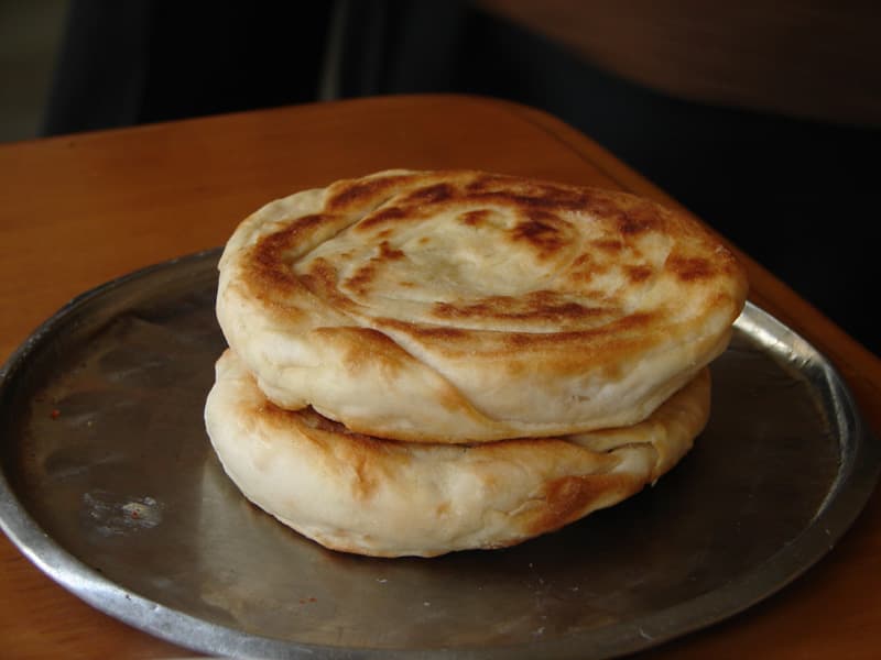 Bing (bread) — a chinese main course dish from China — featuring wheat flour base, flattened disk shape, unleavened variations