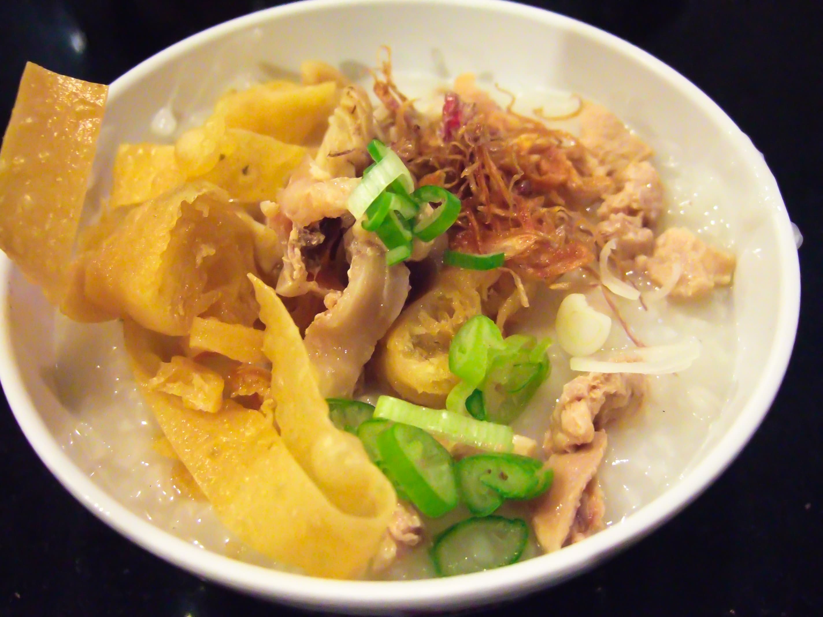 Bubur ayam — a indonesian breakfast dish from Indonesia — featuring soft and savory, layered toppings, mild heat