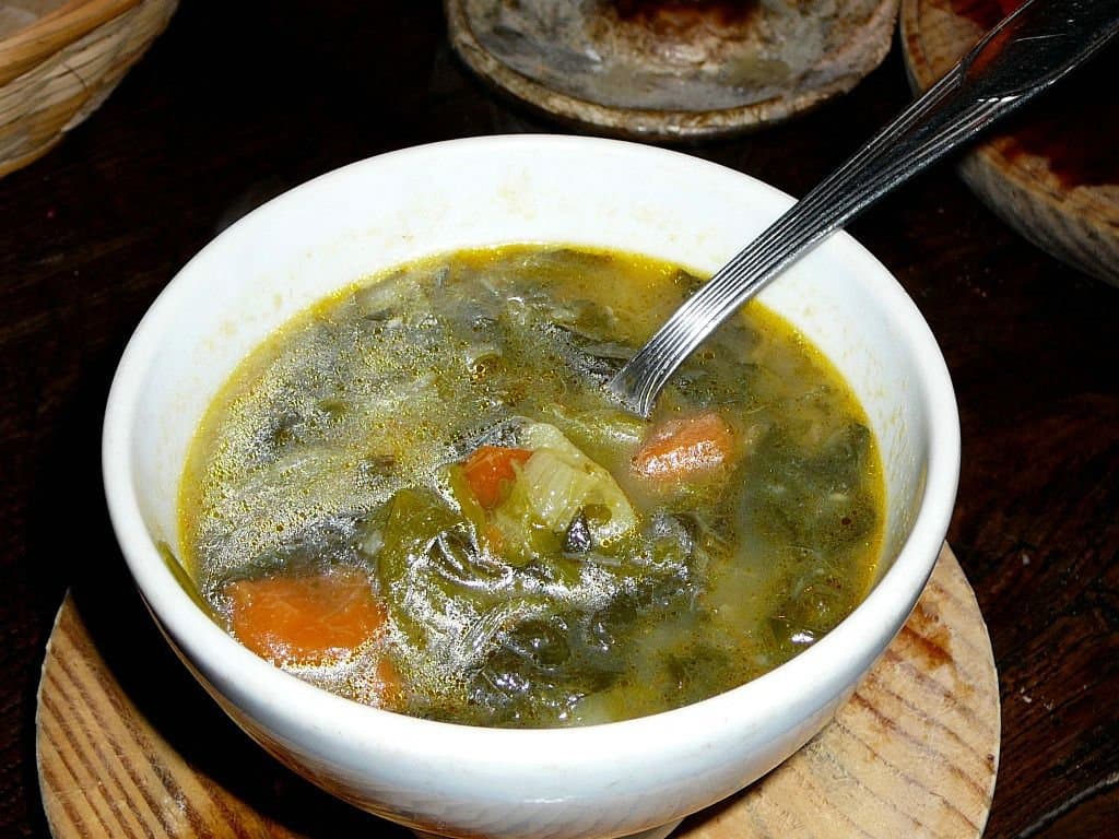 Caldo galego — a spanish appetizer dish from Spain — featuring lard-based, bean-forward, seasonal greens