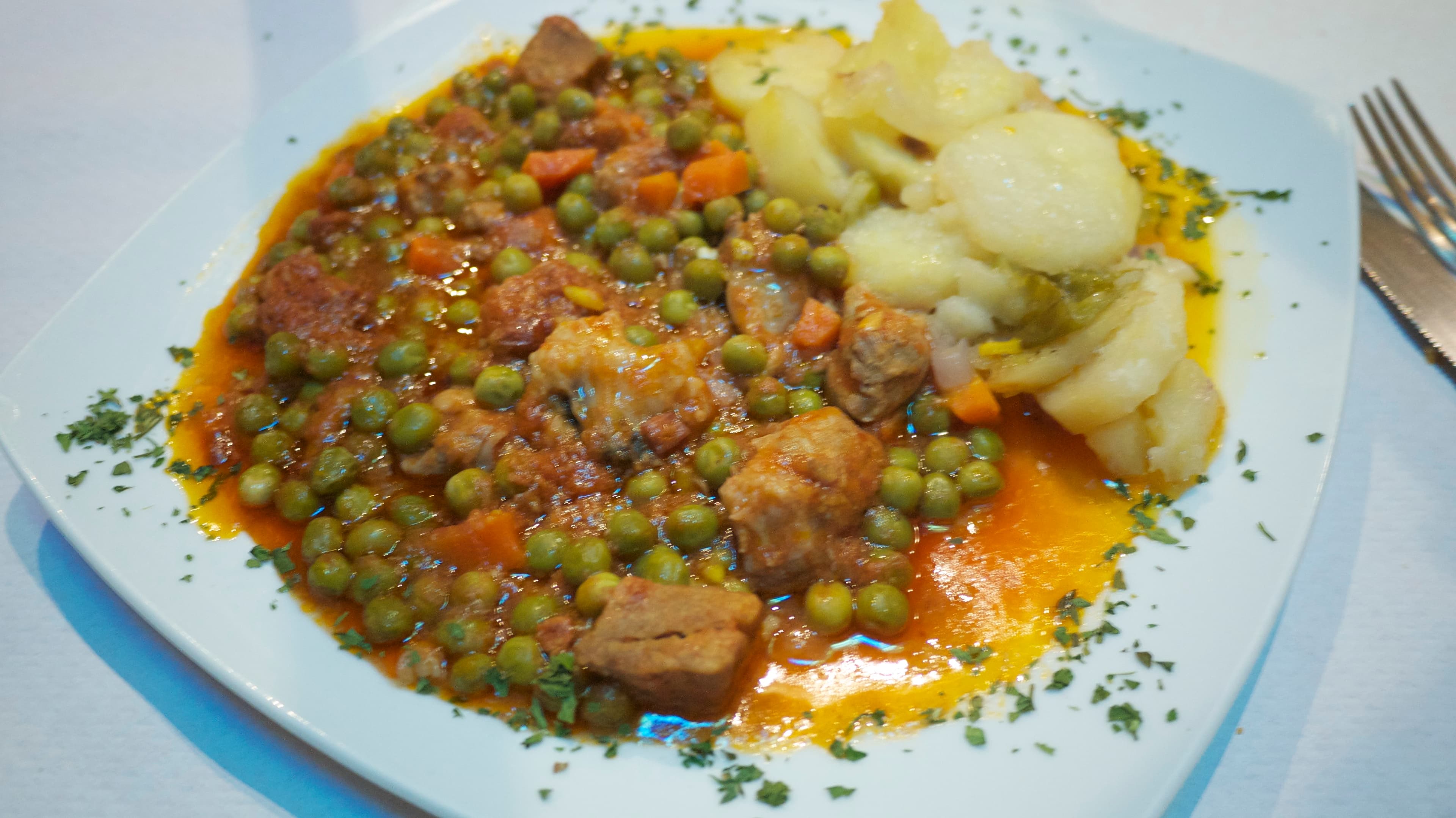 Carcamusas — a spanish main course dish from Spain — featuring earthenware-served, moderately spicy, pork stew