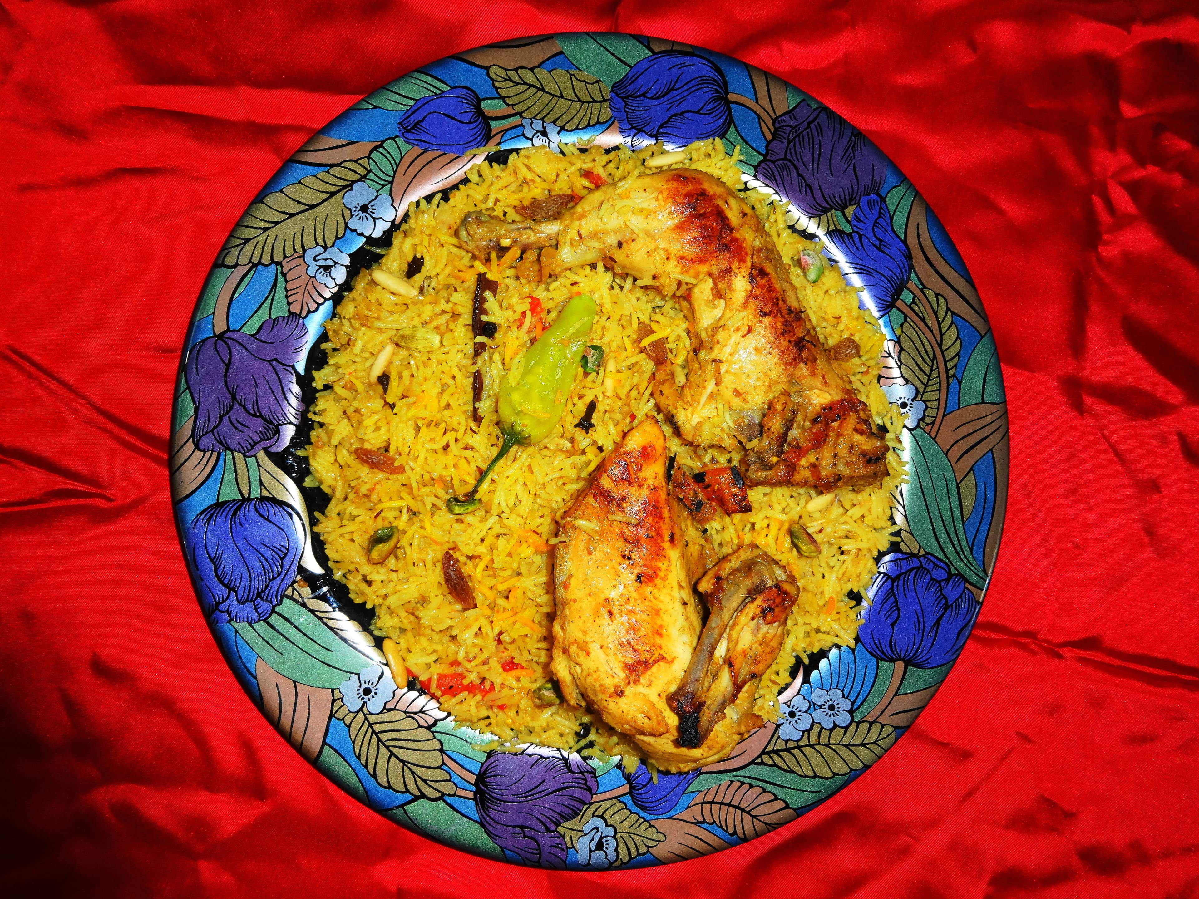 Mandi (food) — a yemeni main course dish from Yemen — featuring pit-cooked, spice-blended, meat and rice