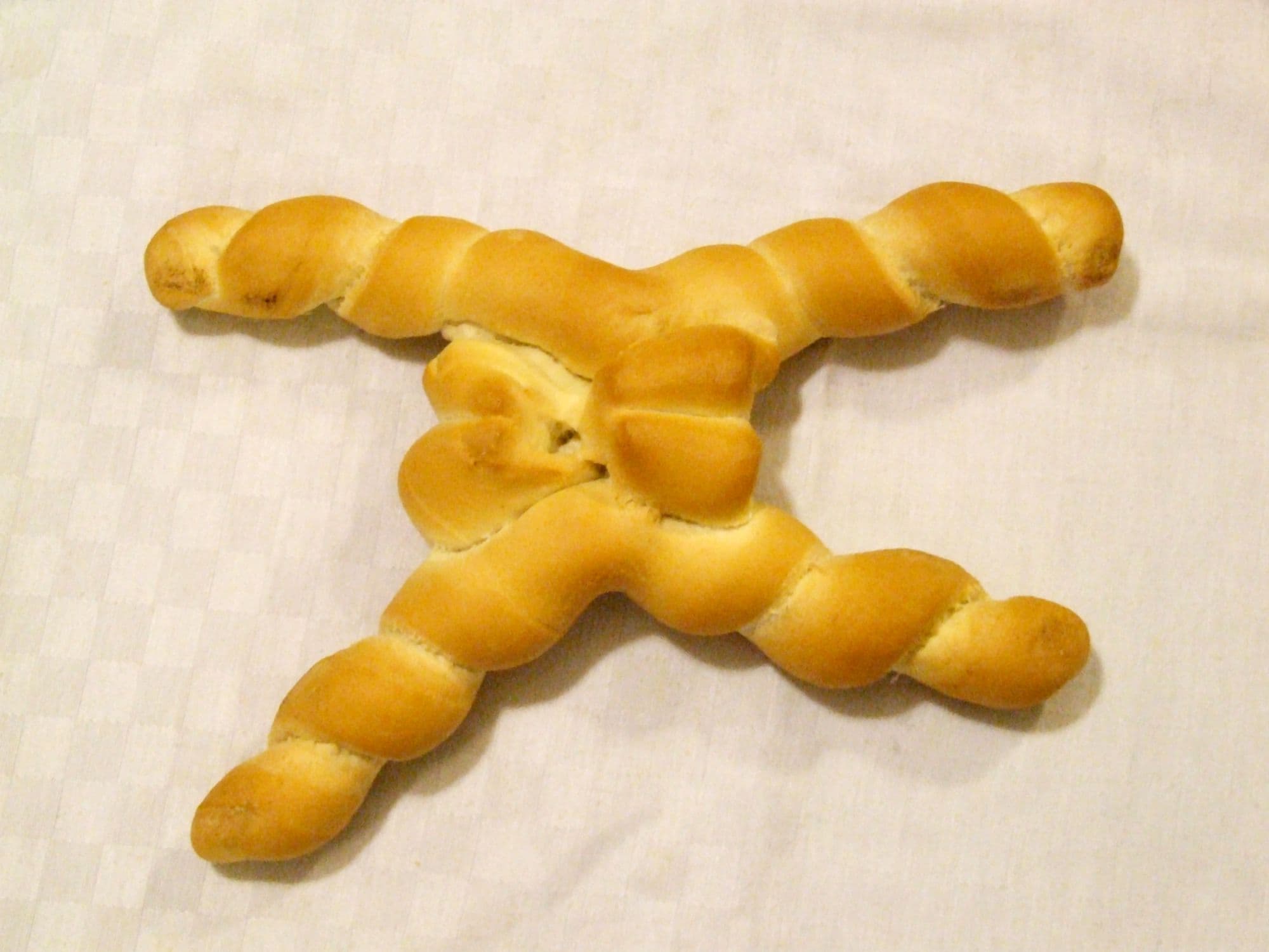 Coppia ferrarese — a italian main course dish from Italy — featuring twisted sourdough, lard-enriched, malted