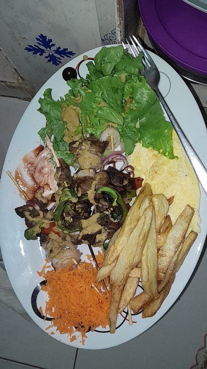 Dibi (food) — a senegalese main course dish from Senegal — featuring wood-fire grilled, heavily seasoned lamb, street food