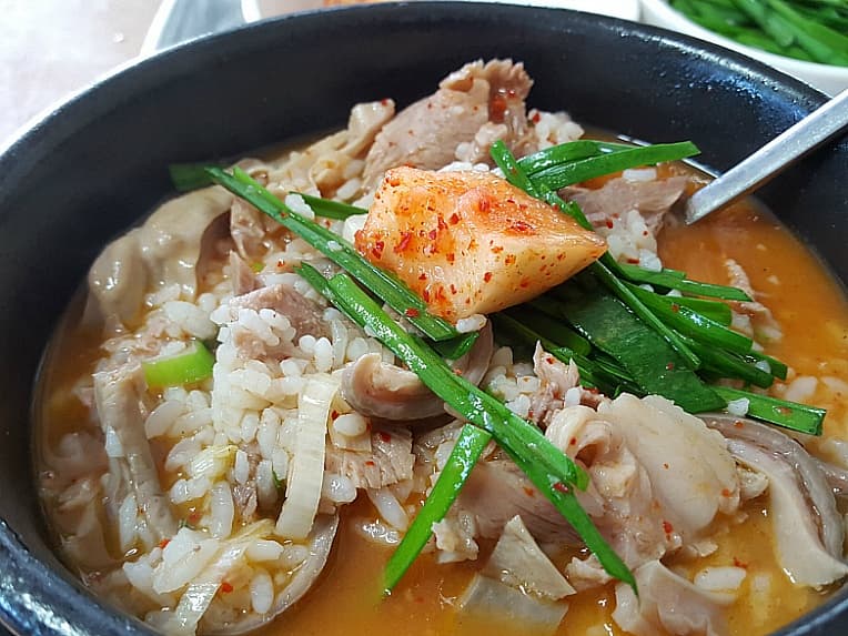 Dwaeji-gukbap — a korean main course dish from South Korea — featuring bone broth base, customizable banchan, morning-to-midnight availability