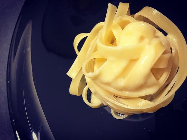 Fettuccine Alfredo — a italian main course dish from Italy — featuring emulsified, minimal ingredients, Roman technique