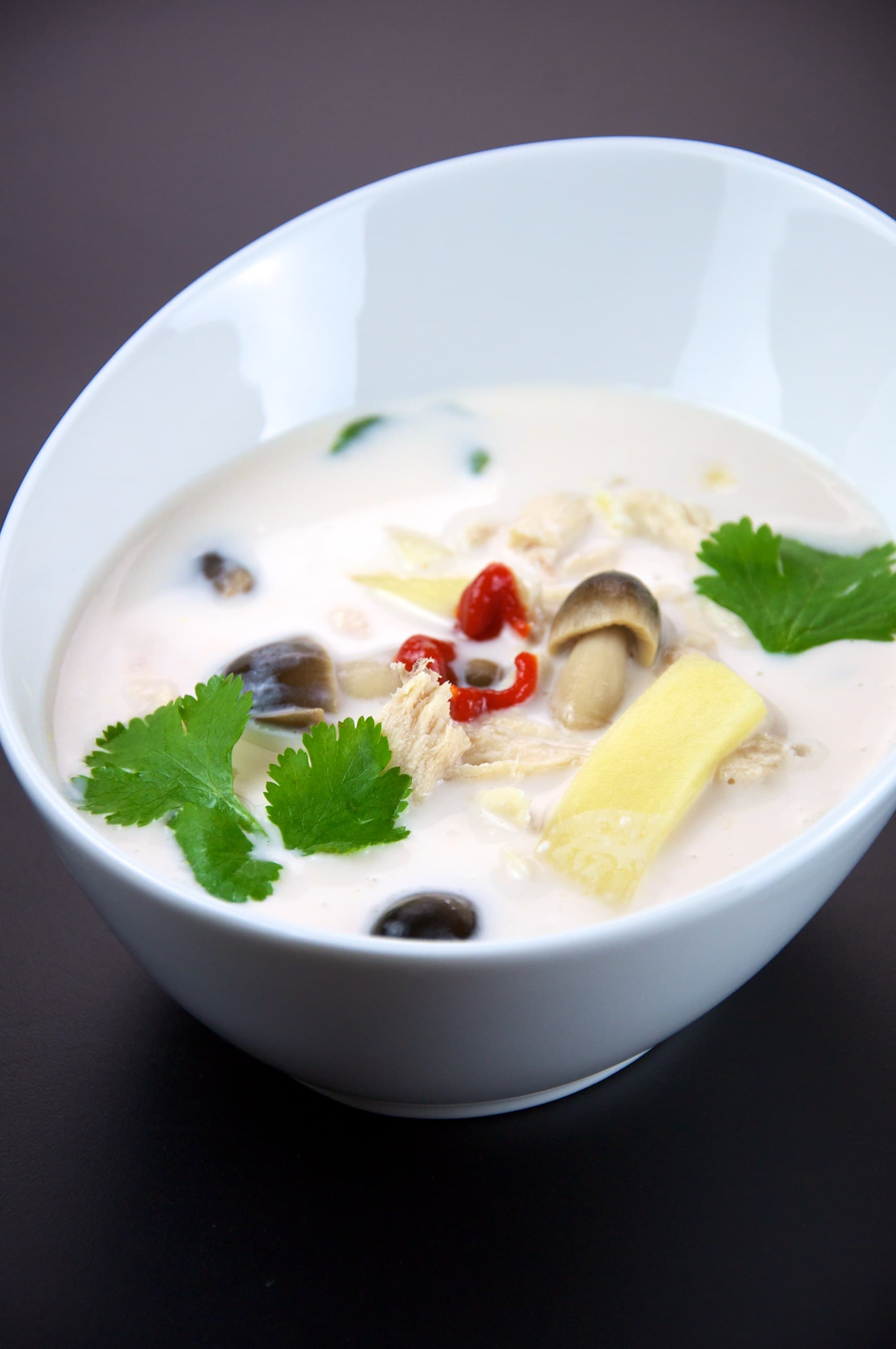Tom Kha Gai — a thai main course dish from Bangkok, Thailand — featuring coconut silk, galangal forward, gentle heat