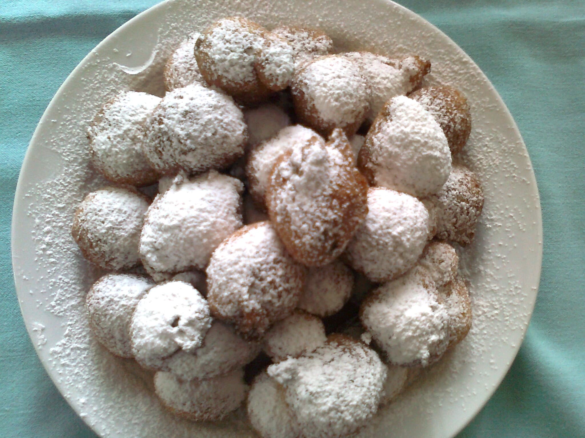 Frittella (doughnut) — a italian main course dish from Italy — featuring yeast-risen, fried golden, citrus-studded