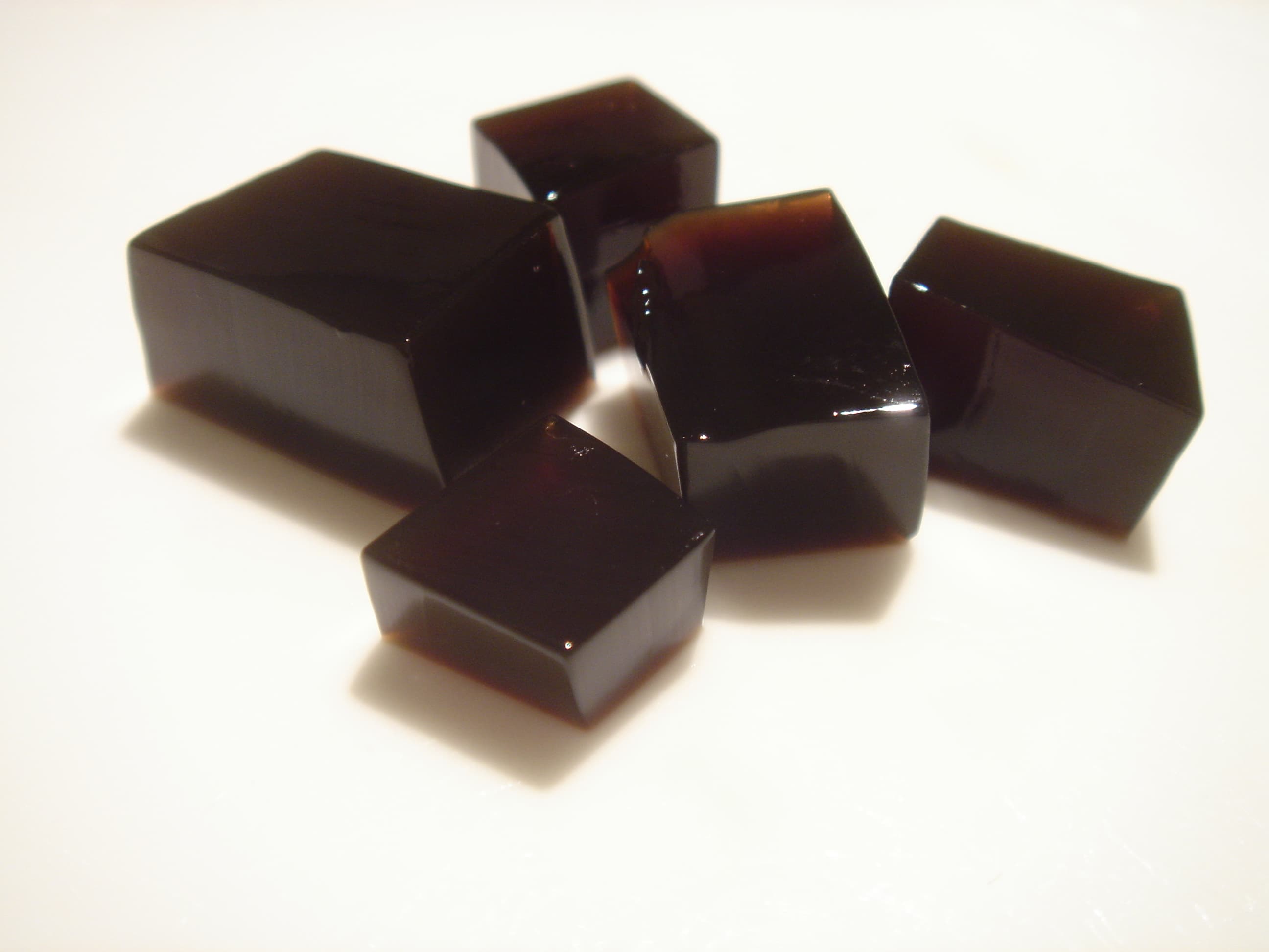 Grass jelly — a people's republic of china cuisine dessert dish from People's Republic of China — featuring herbaceous, chilled, silken texture