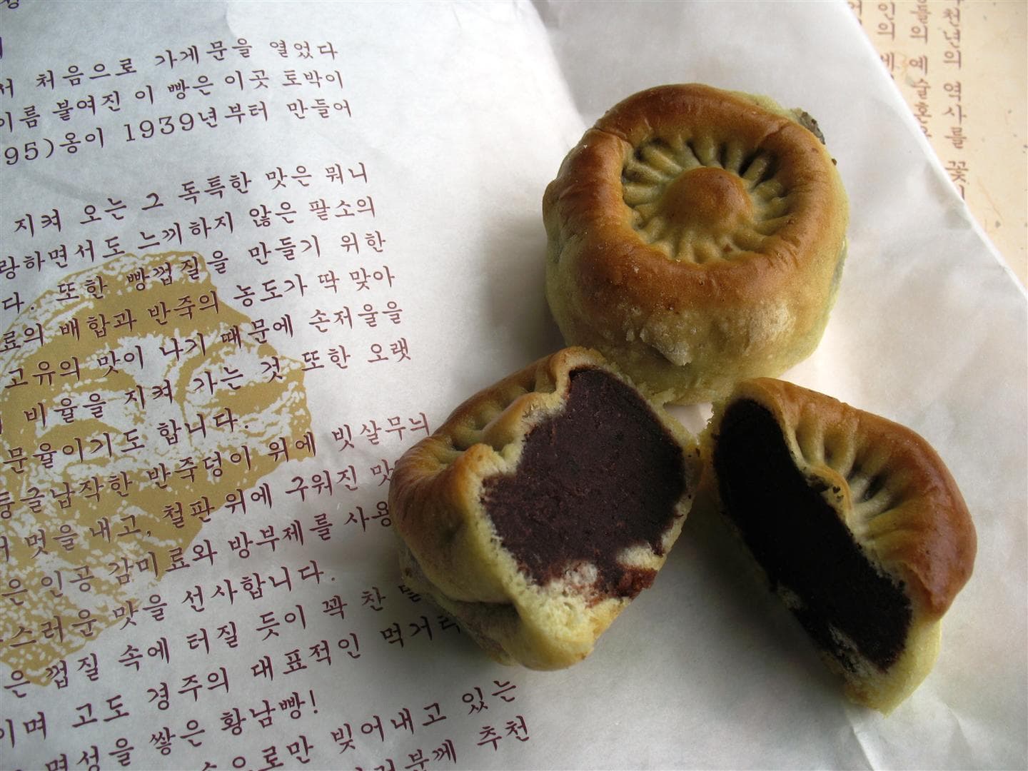 Hwangnam-ppang — a korea under japanese rule cuisine dessert dish from Korea under Japanese rule — featuring hand-crafted, red bean–forward, chrysanthemum-topped