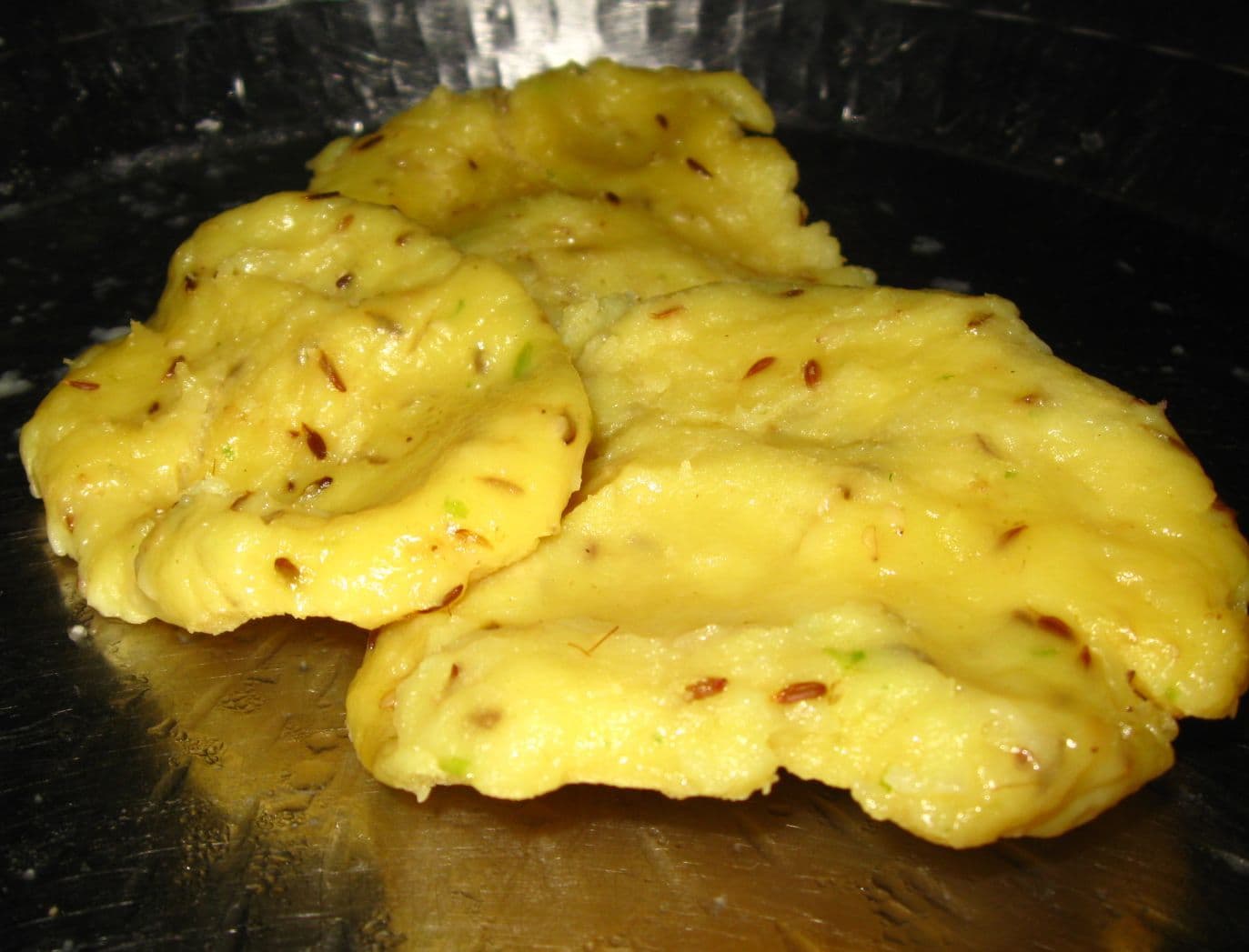 Khichu — a indian snack dish from India — featuring steamed dough, rice flour foundation, mineral alkaline salt