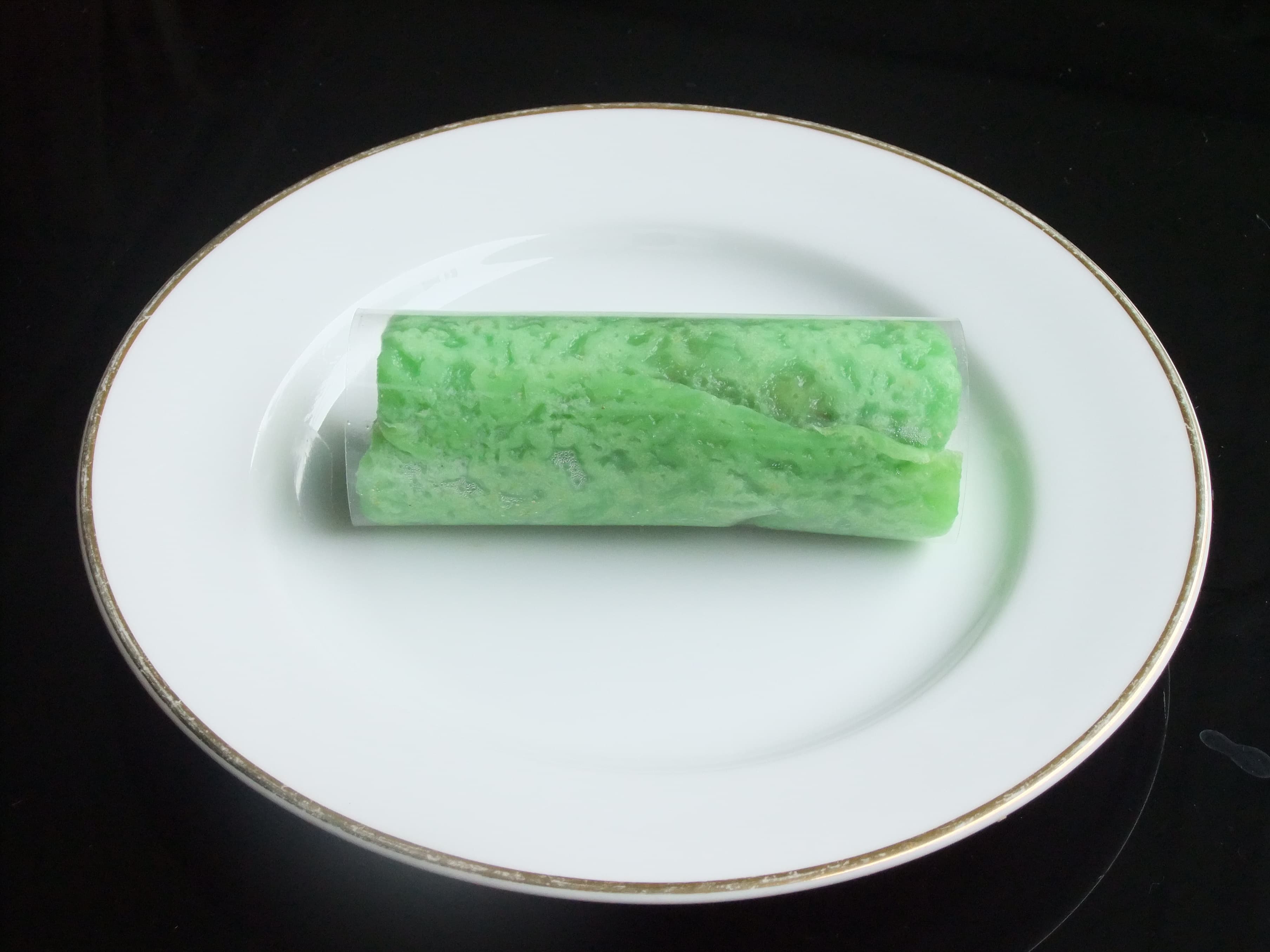 Dadar gulung — a indonesian snack dish from Indonesia — featuring pandan-green, rice flour base, folded pancake