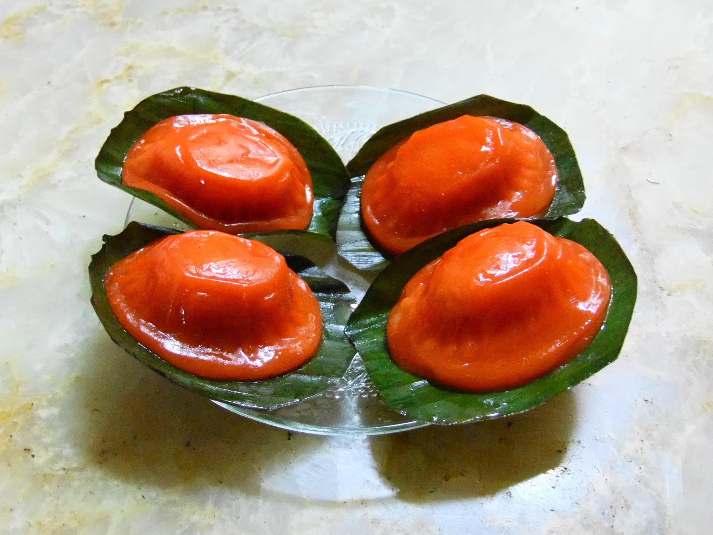 Ang ku kueh — a chinese snack dish from China — featuring glutinous rice flour skin, steamed on banana leaf, tortoise-shaped