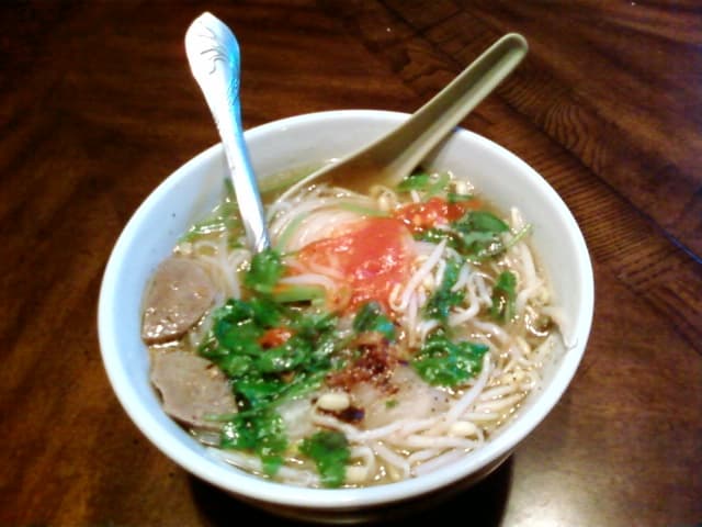 Kuyteav — a cambodian breakfast dish from Cambodia — featuring rice noodle soup, pork stock base, clear broth