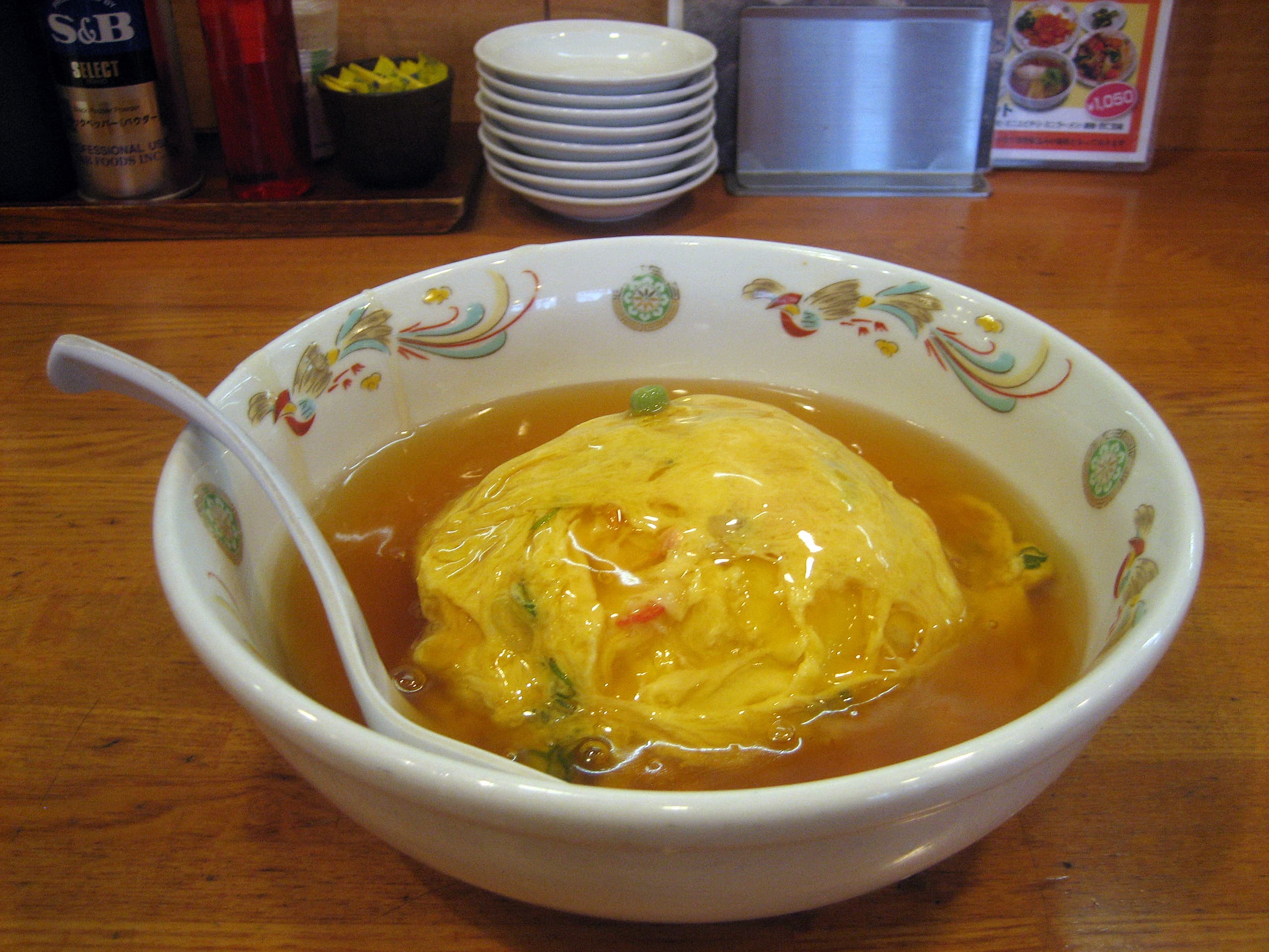 Tenshindon — a japanese main course dish from Japan — featuring crab omelette, rice bowl, post-war Japanese-Chinese
