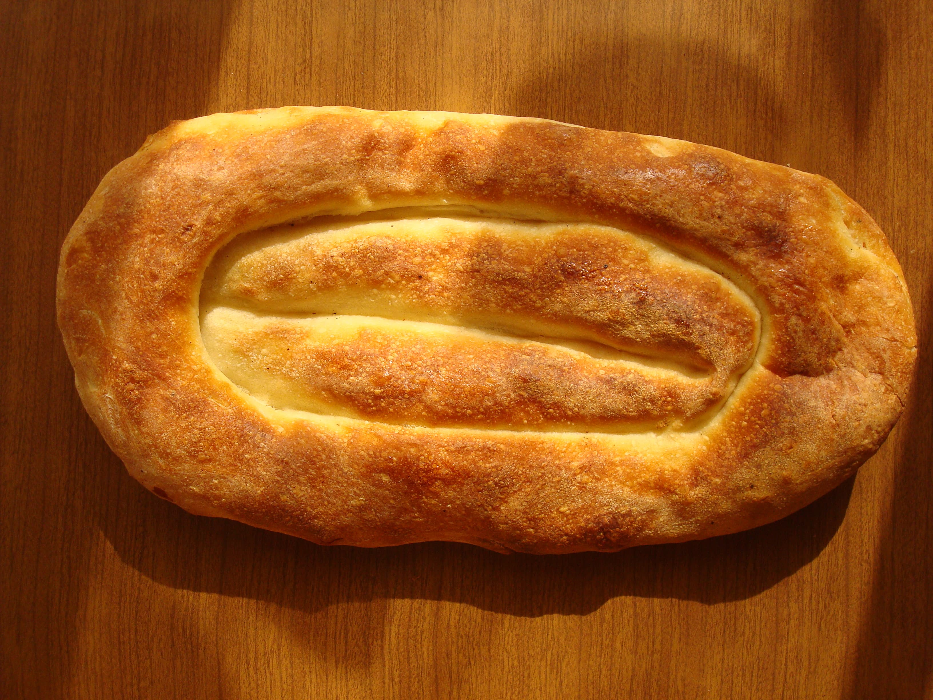 Matnakash — a armenian appetizer dish from Armenia — featuring hand-scored, tea-glazed crust, leavened wheat