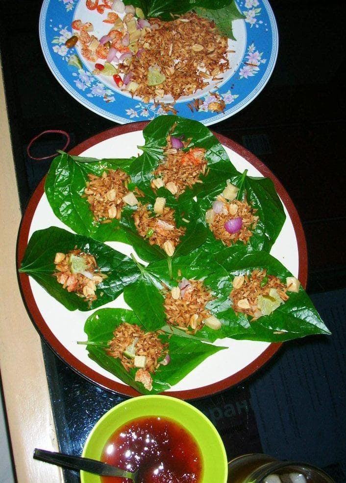 Miang kham — a lao snack dish from Laos — featuring leaf-wrapped, single-bite format, royal heritage