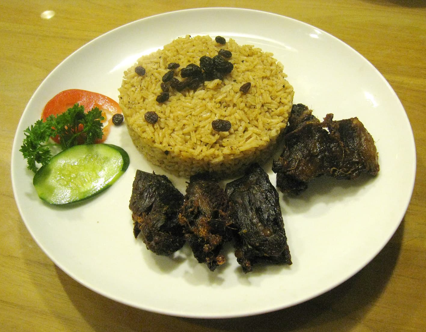 Nasi kebuli — a indonesian main course dish from Indonesia — featuring ghee-enriched rice, goat meat broth base, festive pilaf