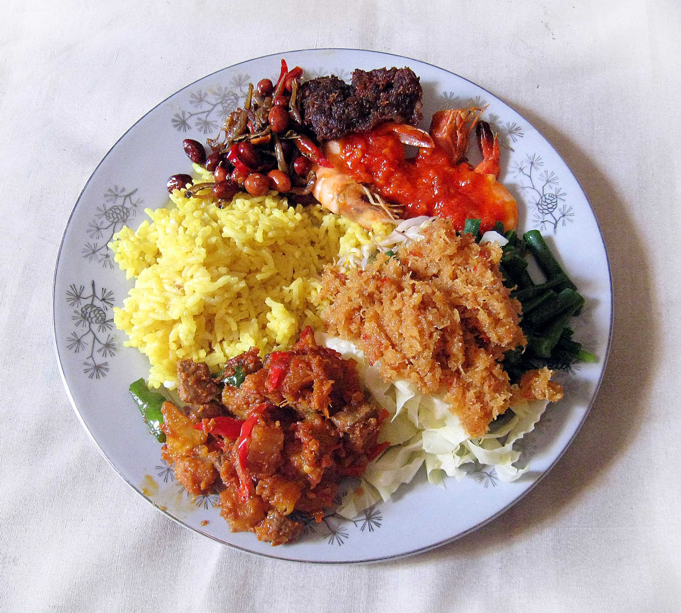 Nasi kuning — a indonesian breakfast dish from Indonesia — featuring coconut-braised, turmeric-forward, fragrant