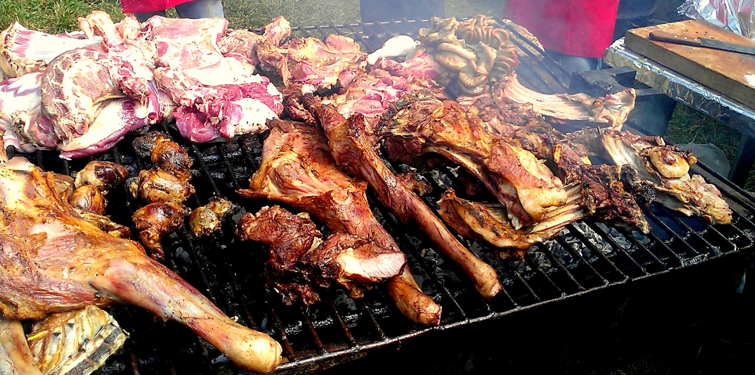Nyama choma — a kenyan main course dish from Kenya — featuring grilled, open-fire cooked, goat or beef