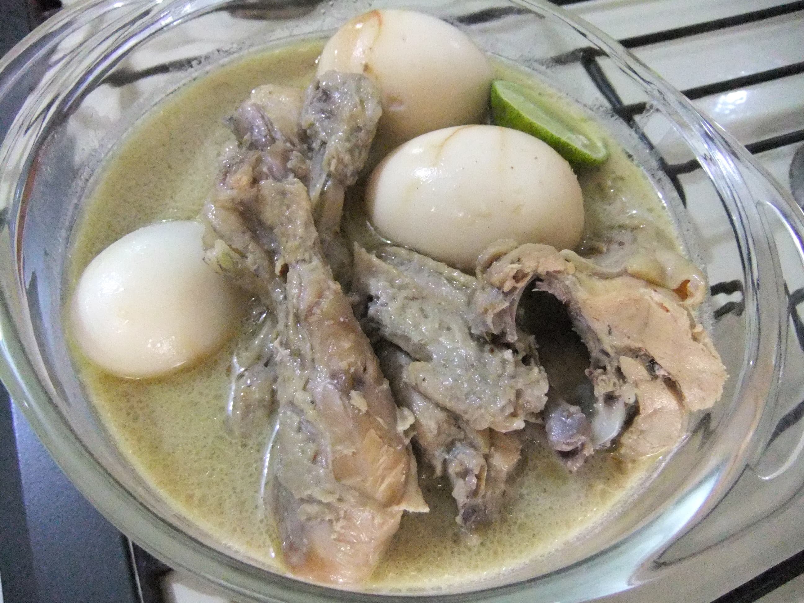 Opor ayam — a indonesian main course dish from Indonesia — featuring coconut-braised, spice-forward, ceremonial