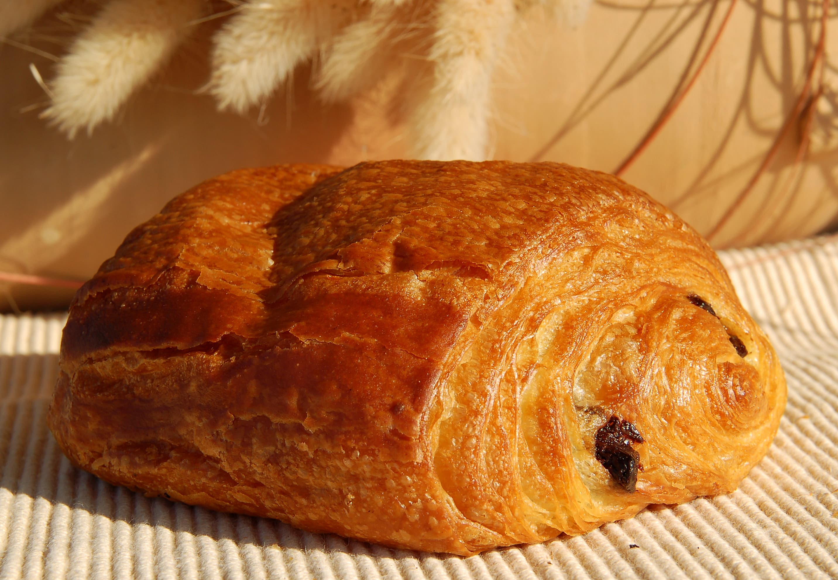 Pain au chocolat — a french main course dish from France — featuring laminated dough, cuboid-shaped, yeast-leavened