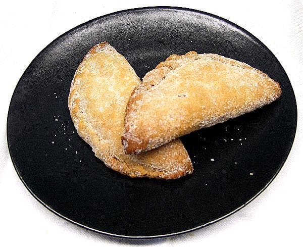 Pastisset — a spanish main course dish from Spain — featuring fried pastry pocket, regional Iberian, multiple fillings