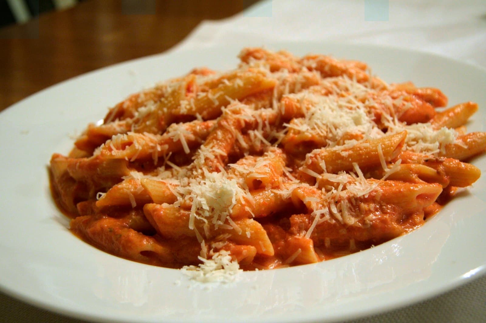 Penne alla vodka — a american main course dish from United States — featuring cream-tomato emulsion, pancetta-forward, disco-era classic