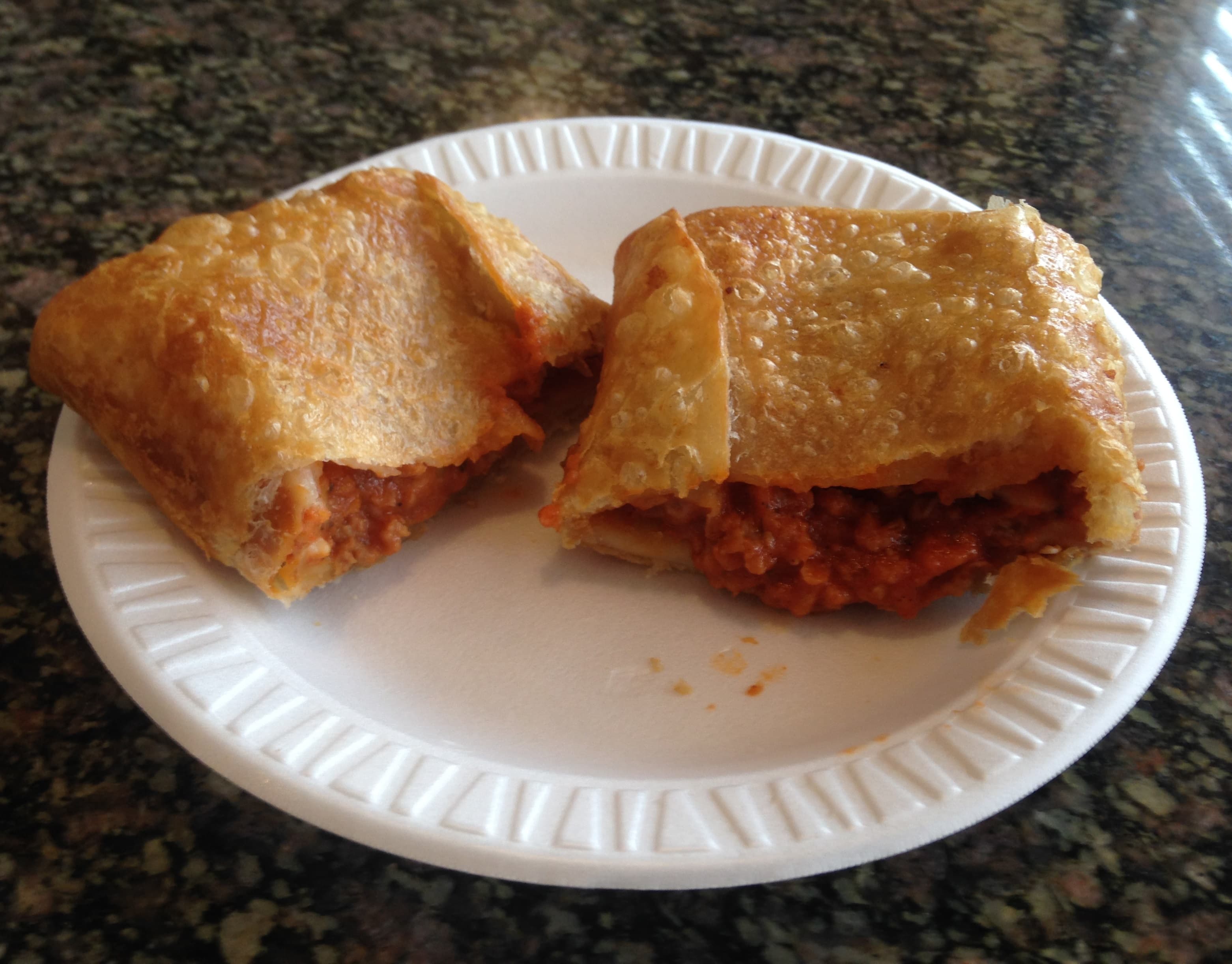 Pizza puff — a american main course dish from United States — featuring deep-fried, hand-held, cheese-forward