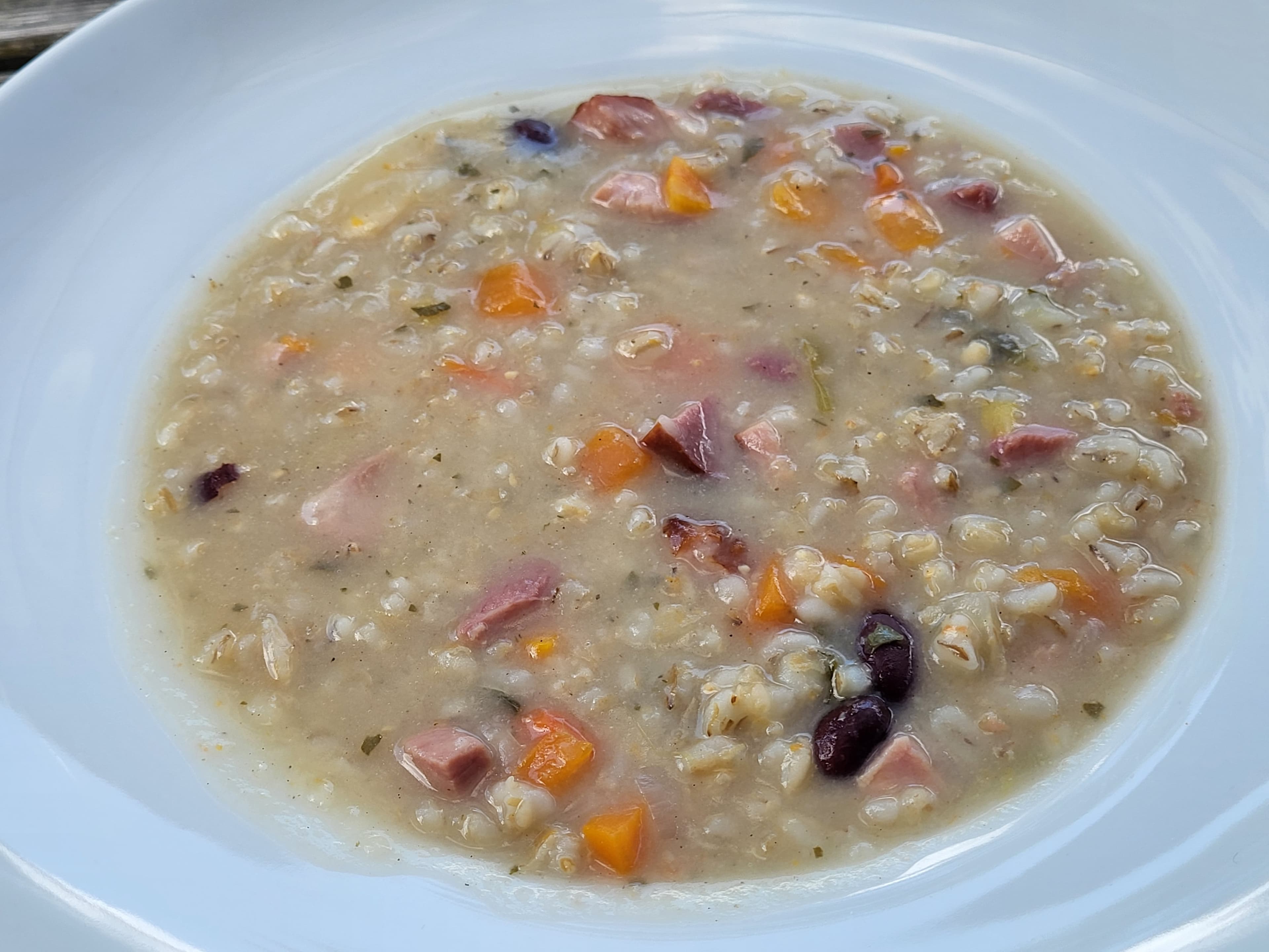Ritschert — a slovenian main course dish from Slovenia — featuring pot barley base, cured pork-forward, variable consistency