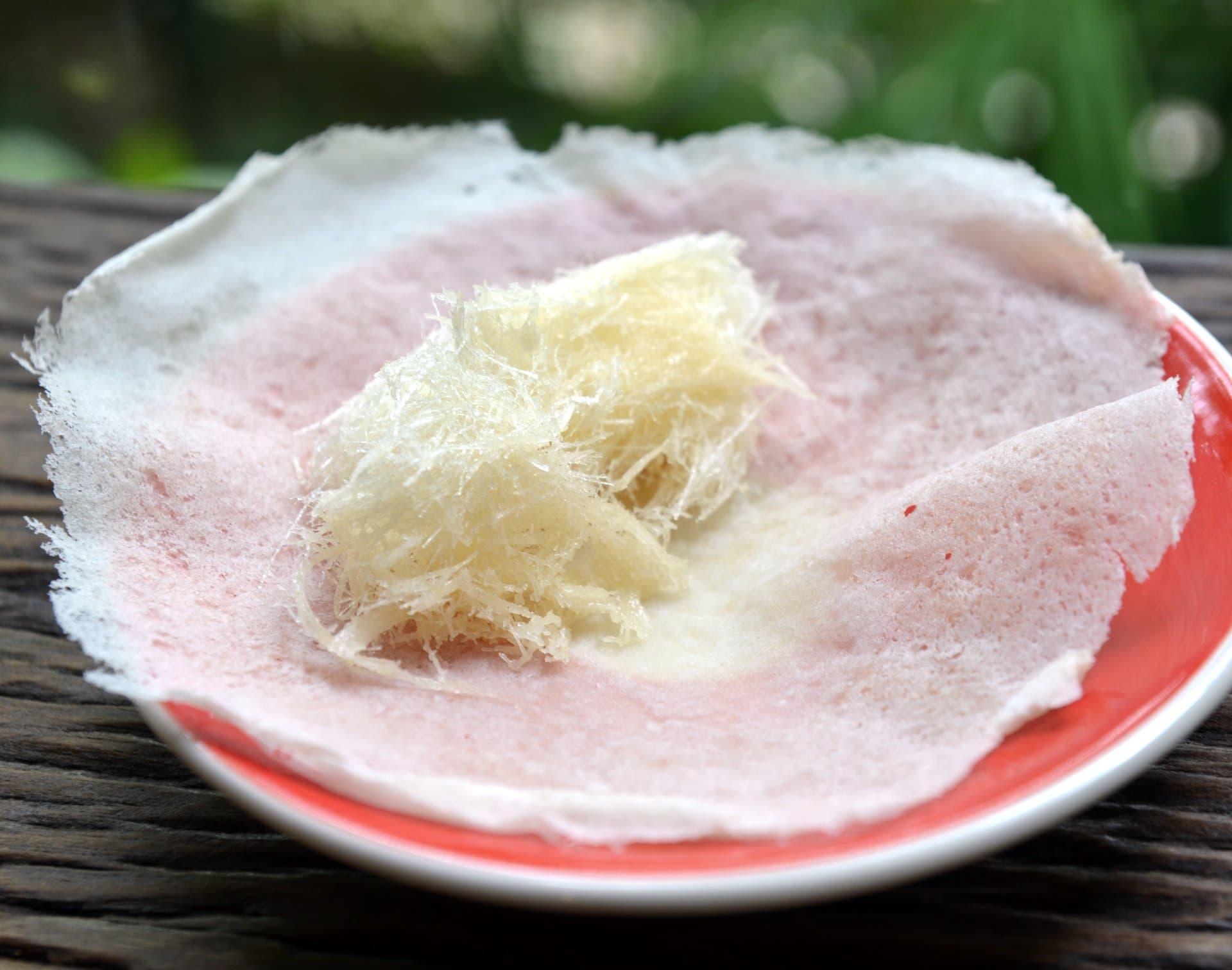 Roti sai mai — a thai dessert dish from Thailand — featuring spun sugar, tissue-thin roti, Indian-Thai fusion