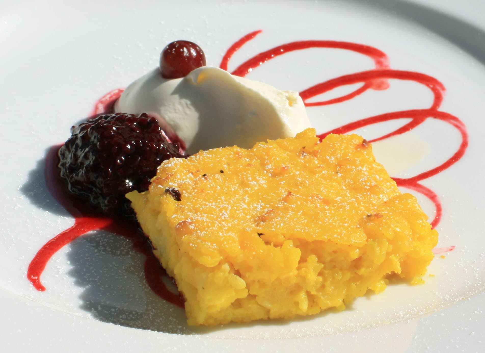 Saffranspannkaka — a swedish dessert dish from Sweden — featuring baked custard, saffron-scented, rice-based