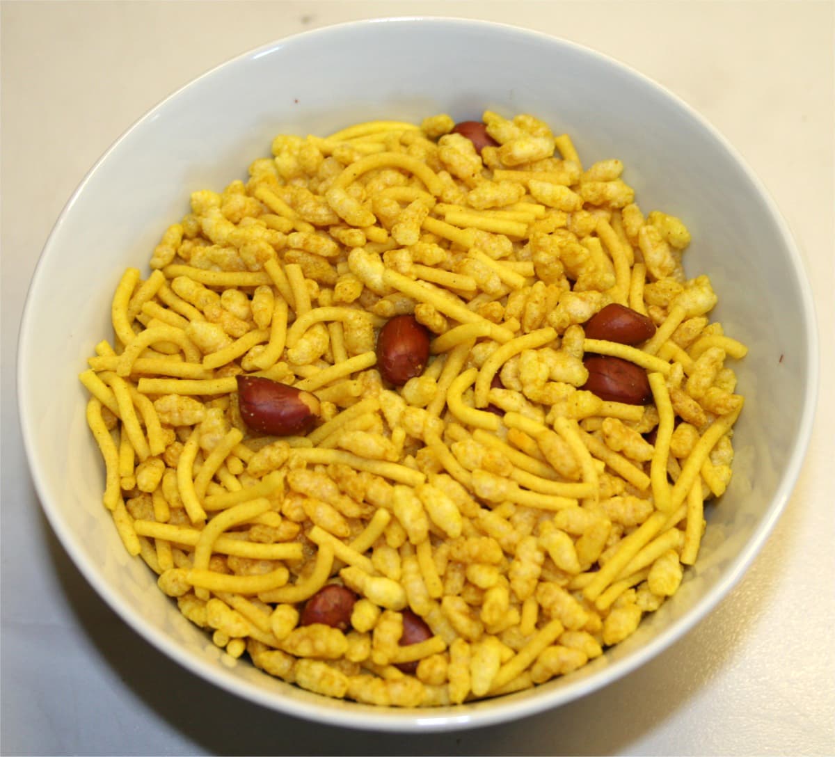 Sev mamra — a indian snack dish from India — featuring dry snack, sautéed, spiced