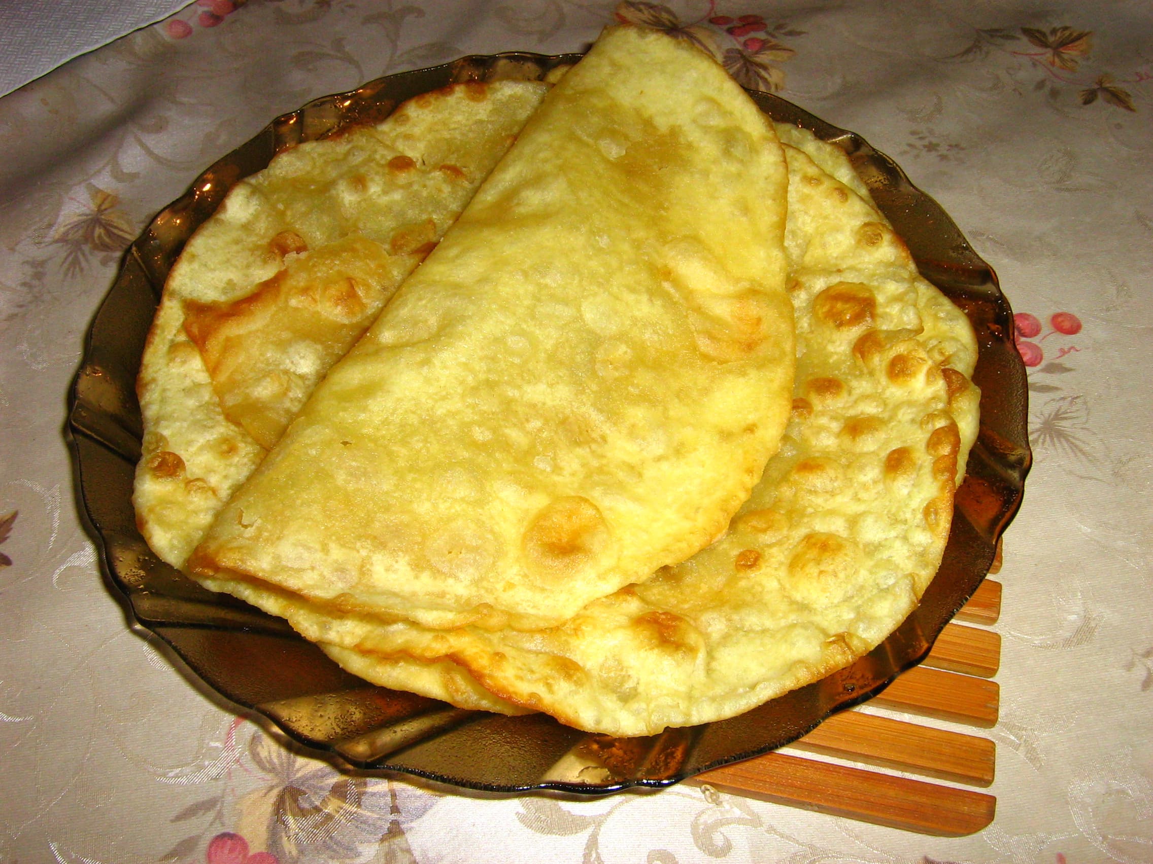 Shelpek — a kazakh main course dish from Kazakhstan — featuring hand-shaped disks, deep-fried, golden crust