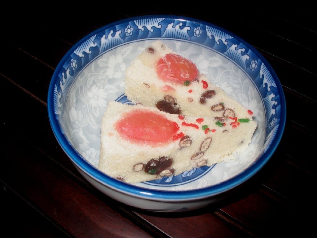 Song gao — a people's republic of china cuisine dessert dish from People's Republic of China — featuring steamed, rice flour base, azuki bean-studded
