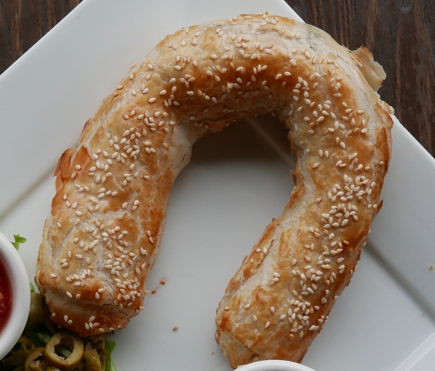 Ziva (dish) — a israeli snack dish from Israel — featuring laminated pastry, cheese & olive filled, sesame-topped