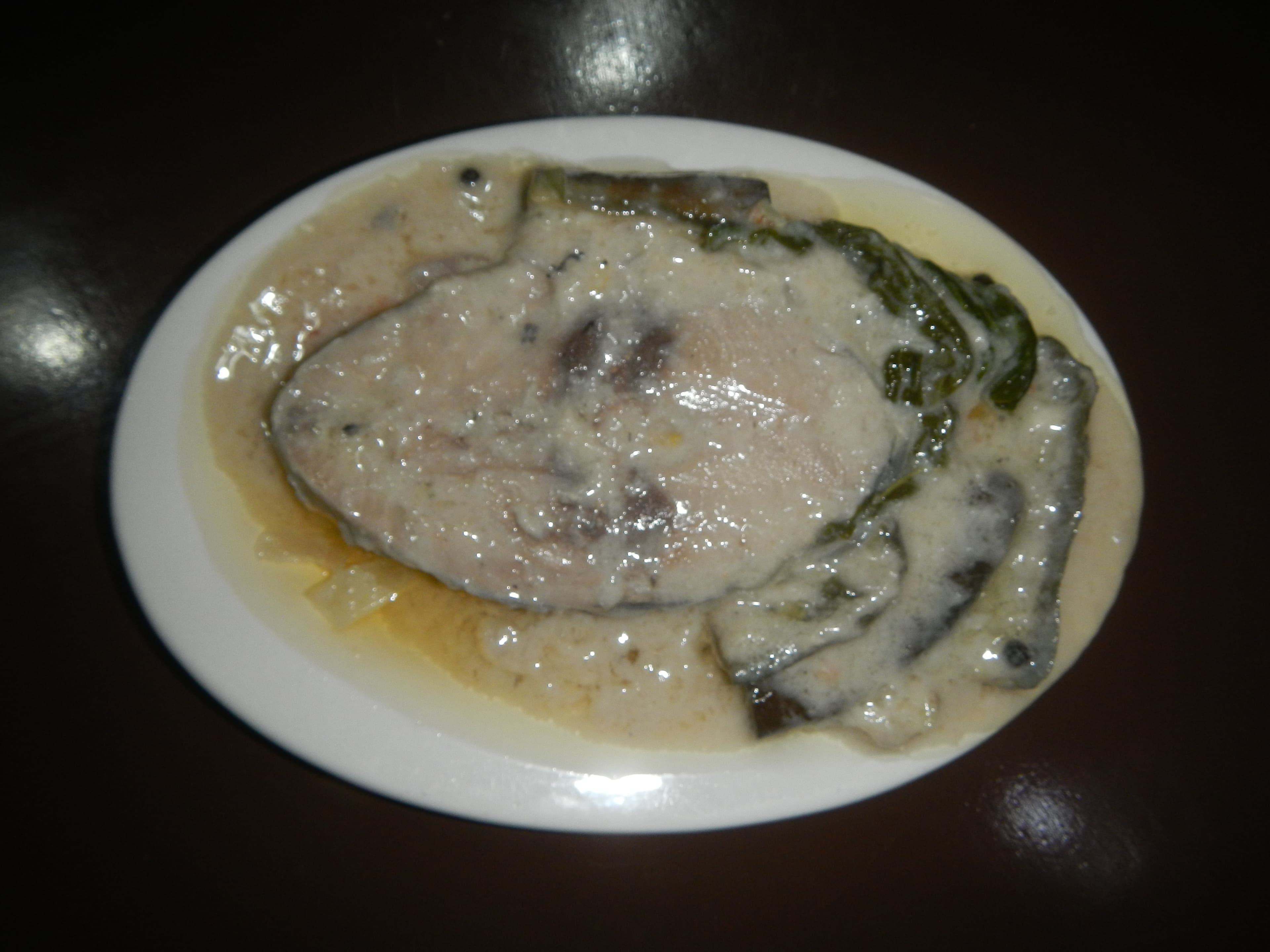 Ginataang isda — a filipino main course dish from Philippines — featuring coconut-milk braise, sour-and-creamy, aromatic base