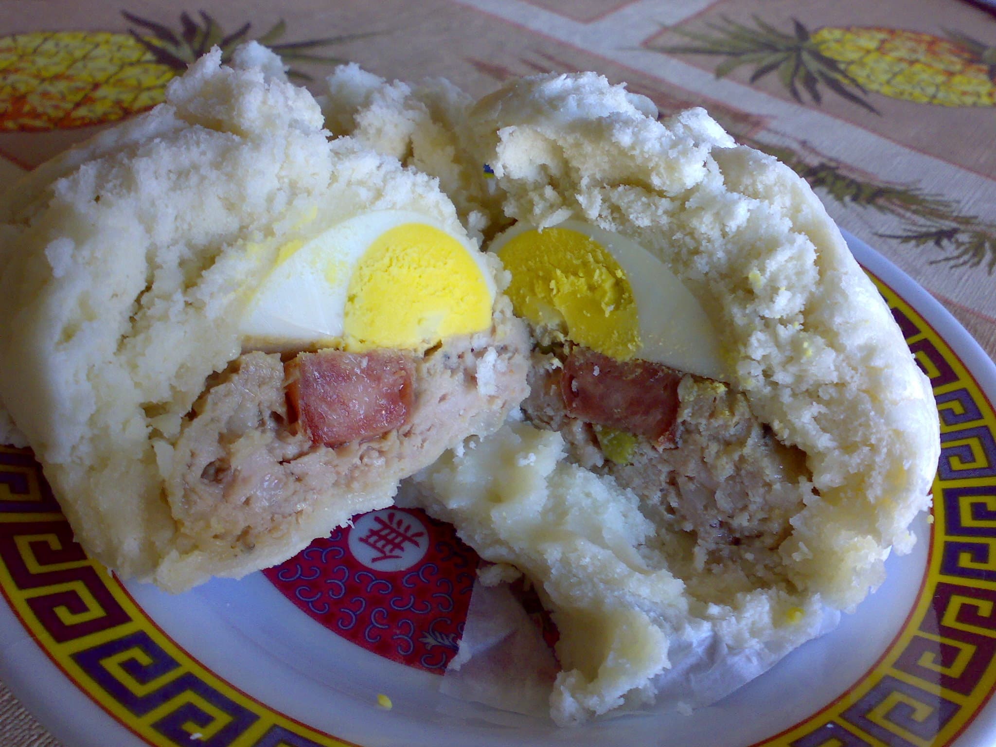 Bánh bao — a vietnamese breakfast dish from Vietnam — featuring steamed sphere, savory filling, street food