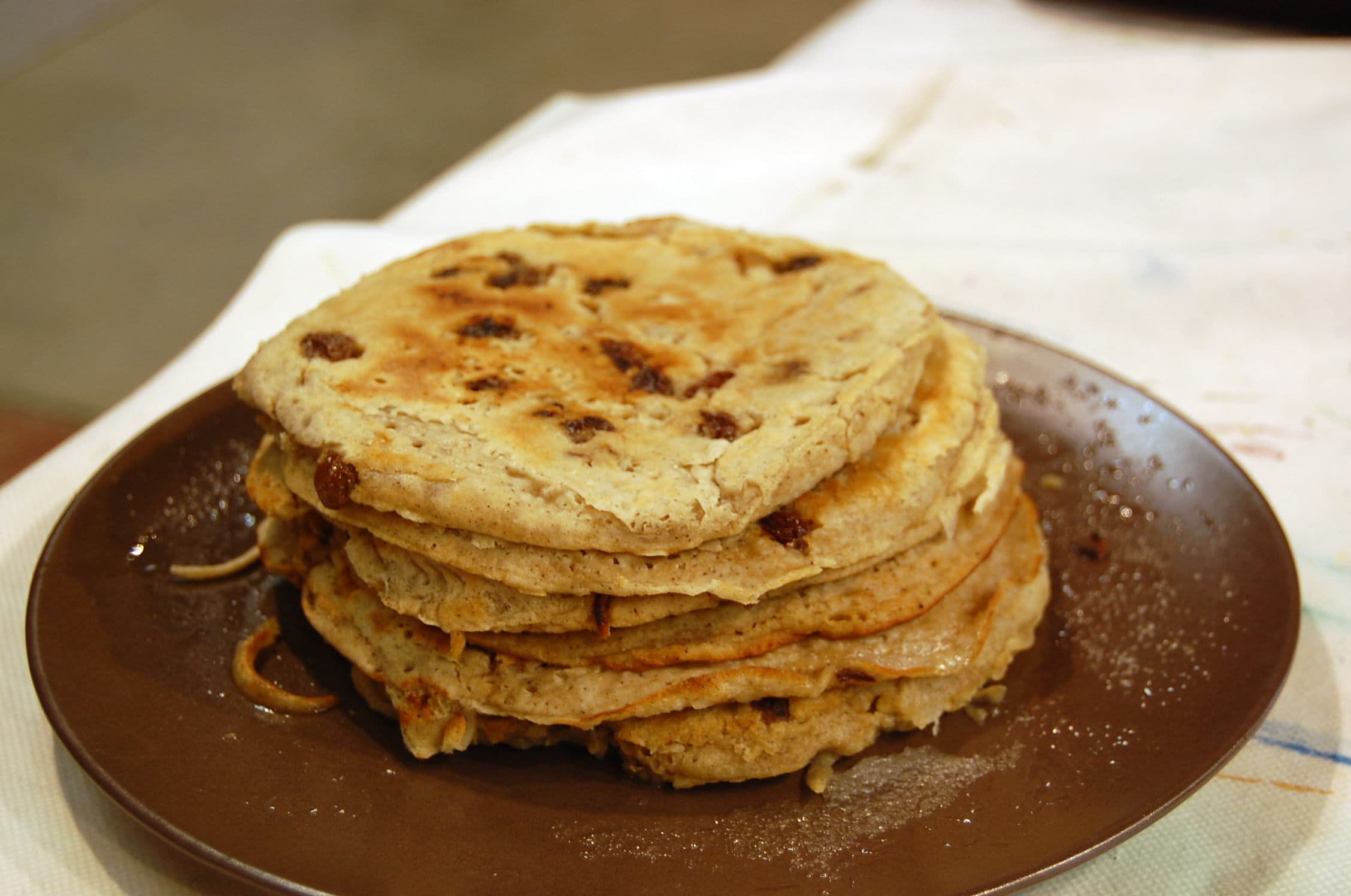 Boûkète — a belgian main course dish from Belgium — featuring buckwheat flour, pan-fried in lard, raisin-studded