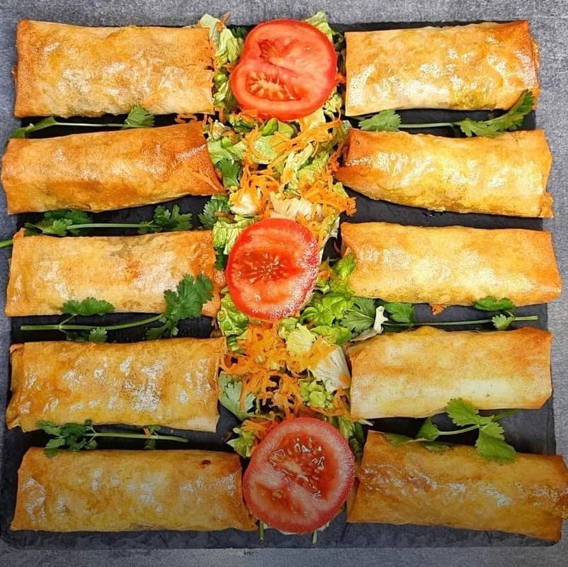 Bourek (Algerian cuisine) — a algerian street food dish from Algeria — featuring thin pastry sheets, potato-forward, hand-folded