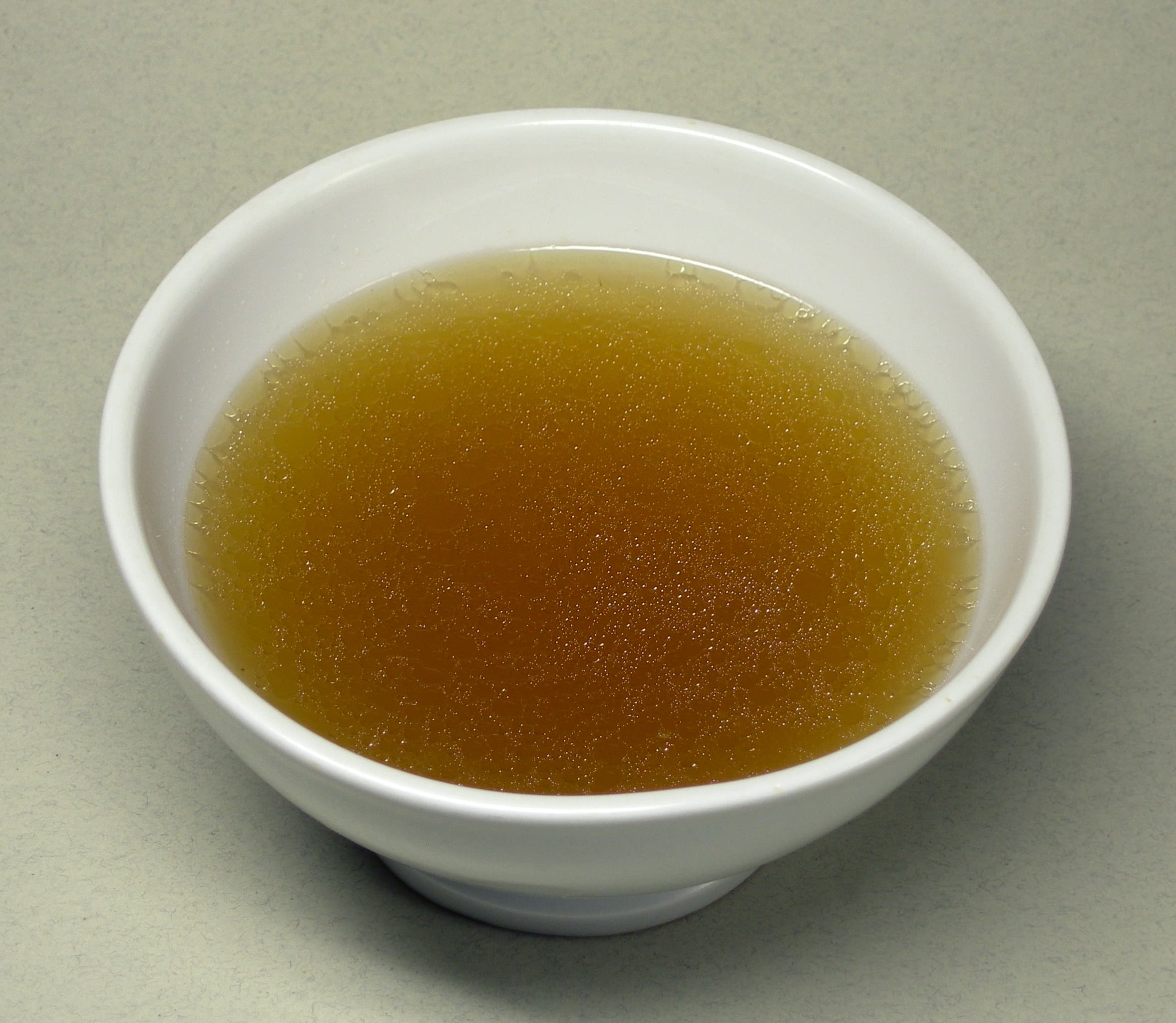 Consommé — a french main course dish from France — featuring clarified broth, egg-white refined, French classical