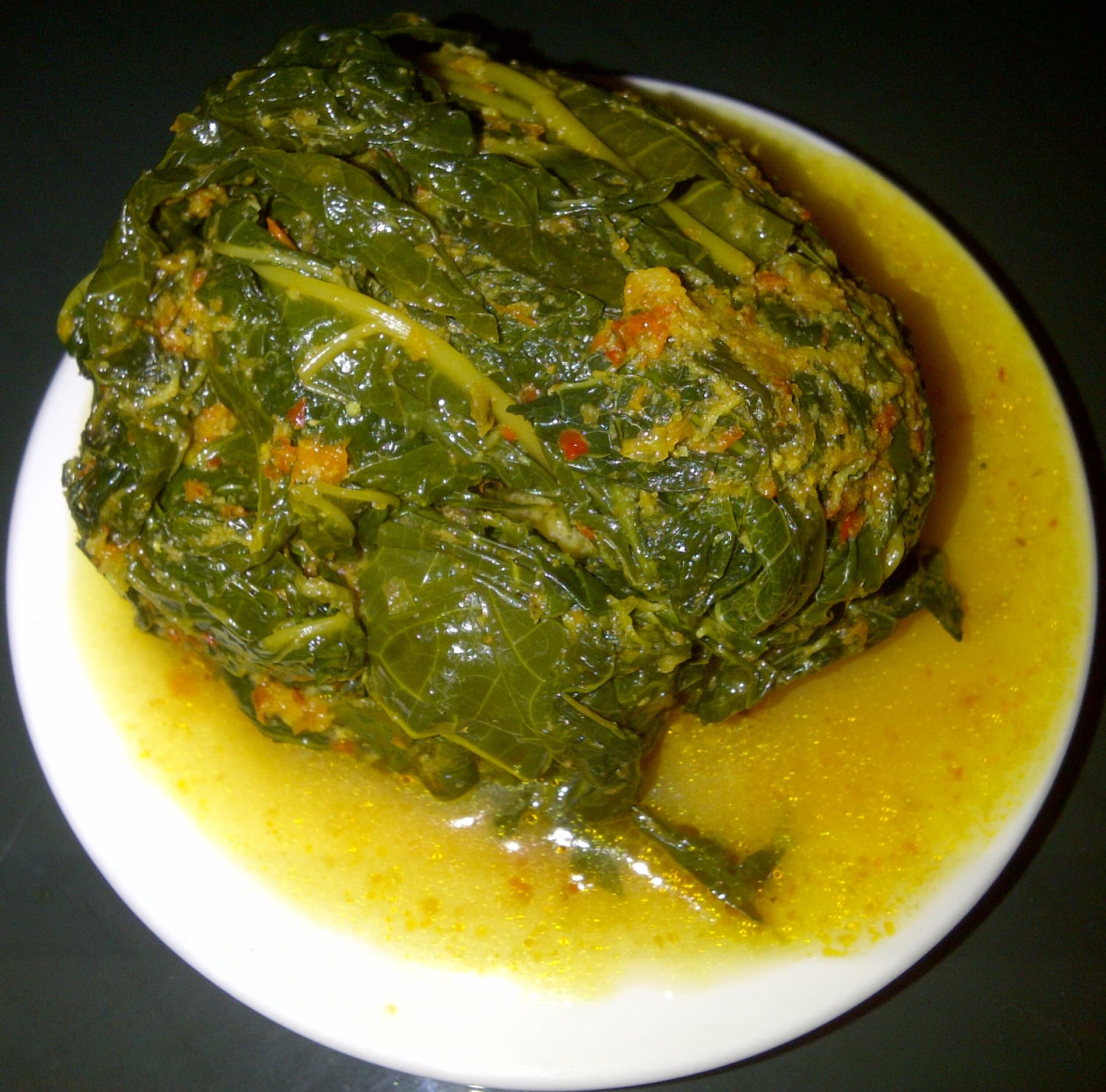 Buntil — a indonesian main course dish from Indonesia — featuring leaf-wrapped, coconut-braised, teri-studded