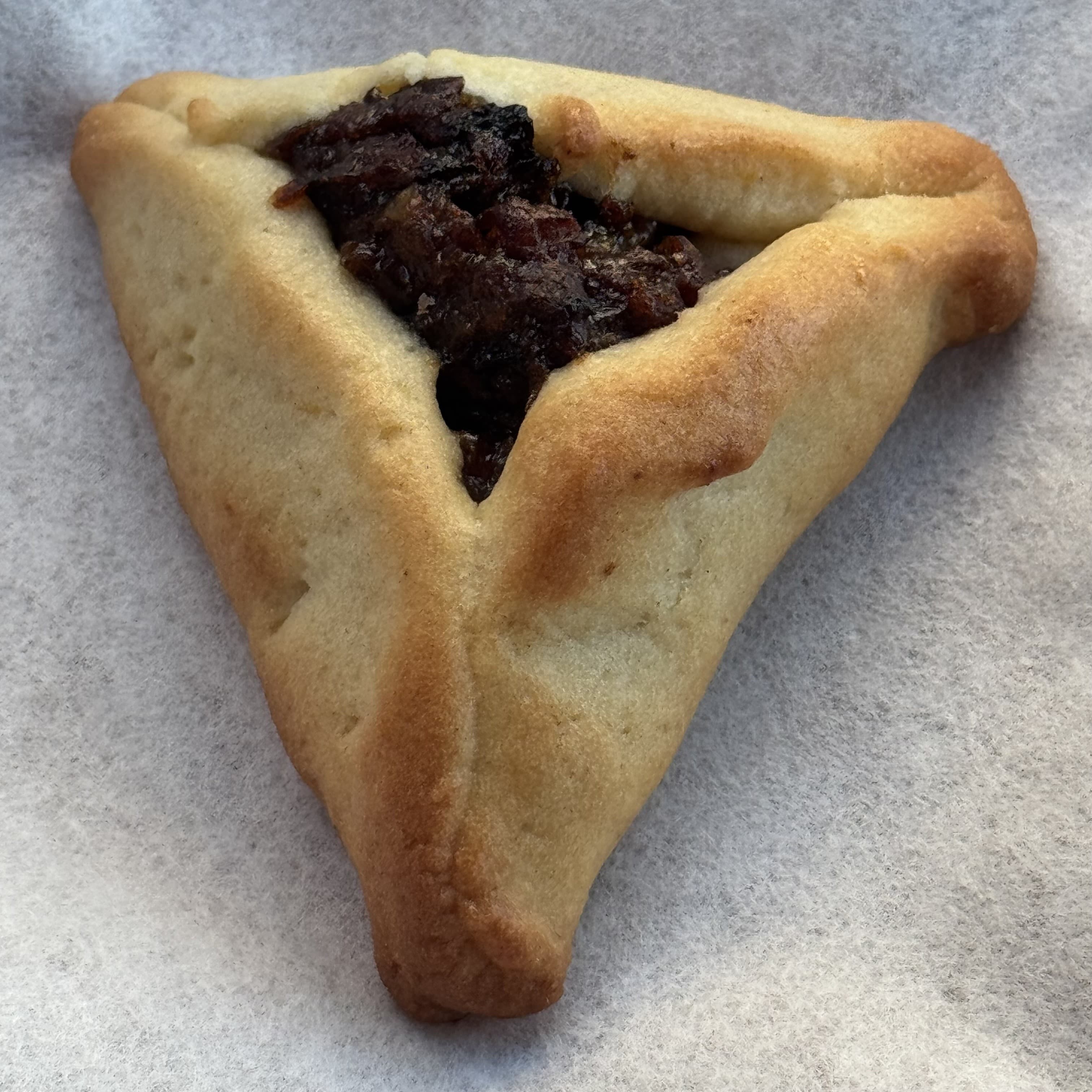 Hamantash — a central europe cuisine main course dish from Central Europe — featuring three-cornered fold, poppy seed tradition, yeast-to-cookie evolution