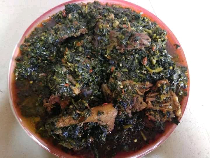 Edikang ikong — a nigerian main course dish from Nigeria — featuring vegetable-forward, meat and seafood layered, leafy base