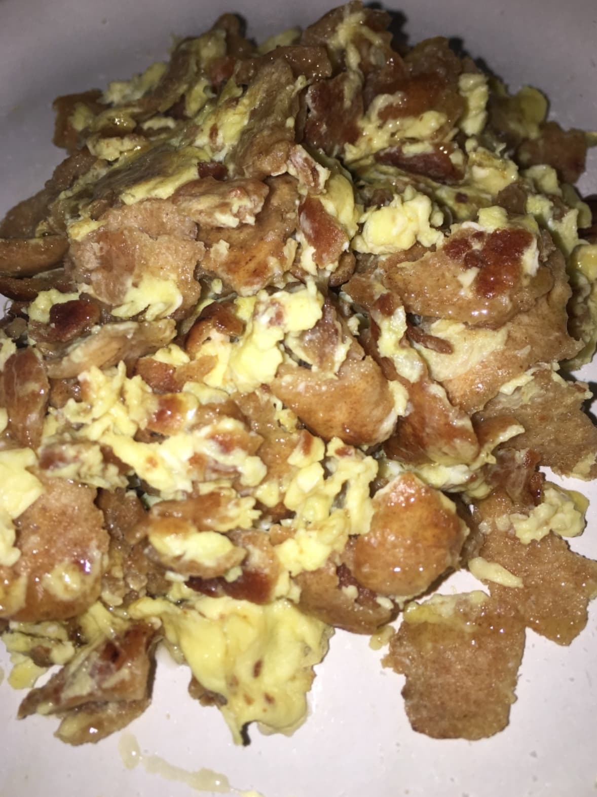 Fatoot samneh — a israeli breakfast dish from Israel — featuring fried flatbread, clarified butter, beaten egg
